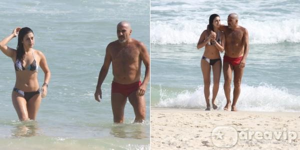 Exibindo novo visual, Eri Johnson curte praia com Fernanda Paes Leme