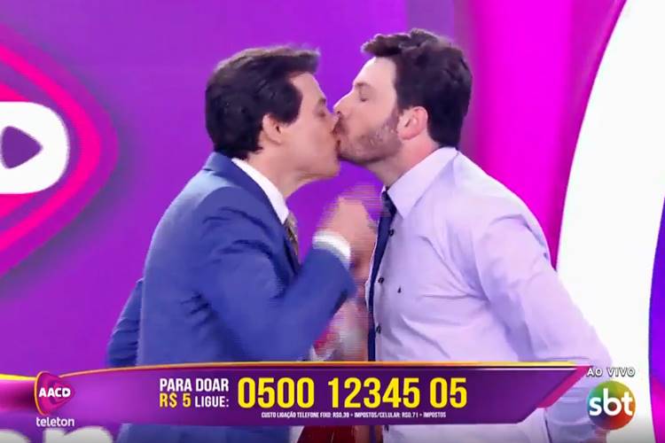 Portiolli e Gentili se beijam para comemorar marca de R$ 12 milhões no Teleton