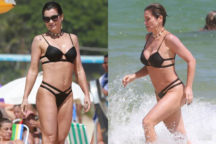 Flávia Alessandra se diverte na praia da Barra da Tijuca