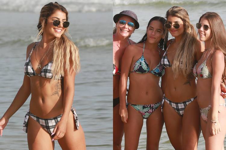 Hariany curte praia na Barra da Tijuca e tira foto com fãs