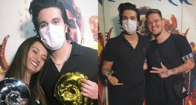 Luan Santana usa máscara para receber fãs no camarim
