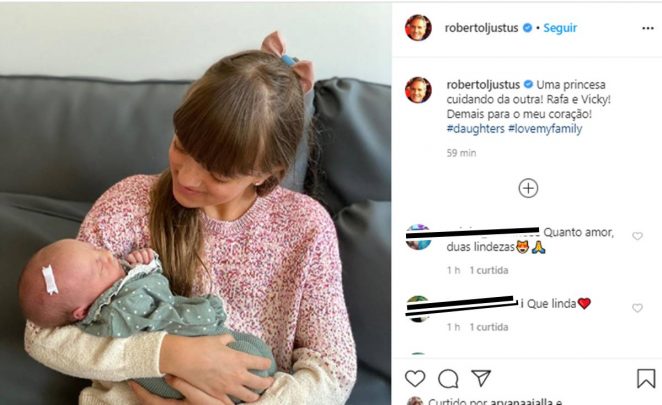 Filha de Roberto Justus segura a irmã pela primeira vez