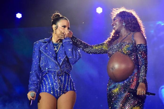 Ivete Sangalo e Iza Ivete Sangalo e Iza no Rock In Rio (Fotos Natália Rampinelli/ Agnews)