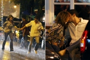 Maitê Proença e o namorado correm para fugir da chuva