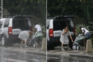 Fernanda Lima socorre filhos gêmeos da chuva
