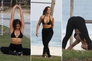 Nana Gouvêa é clicada se exercitando na praia