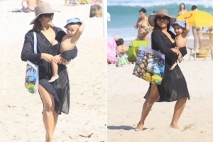 Dira Paes curte praia com o filho