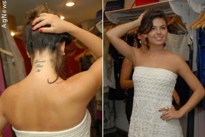 Isis Valverde exibe tatuagem em evento de moda