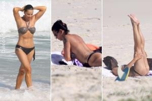 Luiza Brunet tira a parte de cima do biquíni para se bronzear