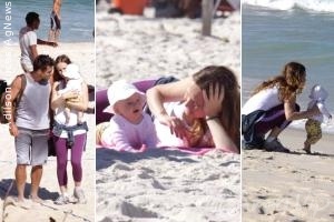 Fernanda Rodrigues e Raoni Carneiro levam a filha para passeio na praia