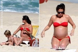 Grávida de gêmeas, Giovanna Antonelli exibe o barrigão na praia