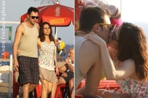 Alessandra Negrini namora enquanto toma água de coco na orla de Ipanema