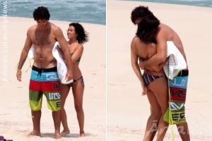 Daniele Suzuki troca carinhos com o noivo em praia carioca